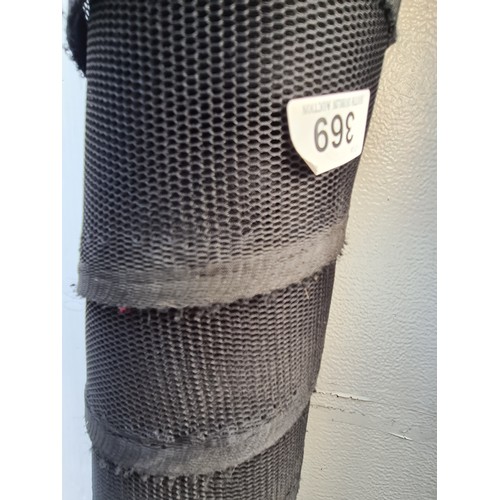 369 - A large bolt / roll of black mesh stretch fabric.