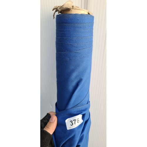 376 - A large bolt / roll of cotton fabric in a bright blue shade.