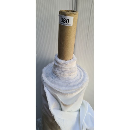 380 - A large bolt / roll of white fabric. Would suit curtain lining projects.