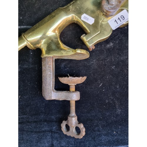 119 - A fabulous antique counter mounted bottle opener made from heavy brass and iron.