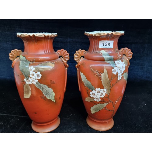 138 - A handsome pair of large antique ceramic Japanese vases featuring lovely hand painted floral and fol... 