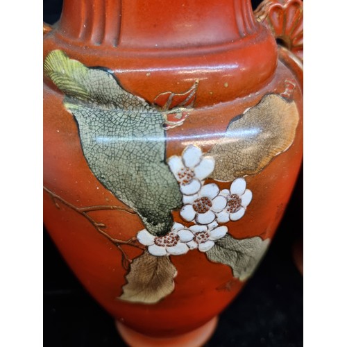 138 - A handsome pair of large antique ceramic Japanese vases featuring lovely hand painted floral and fol... 