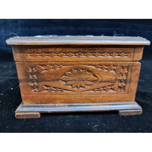 150 - A beautiful and intricately carved wooden storage box with an Art Nouveau hammered pewter top.