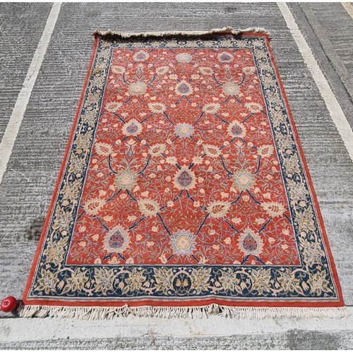 358 - Star Lot : A beautiful super large rug in a floral pattern orange, beige, green and blue tones.
MM: ... 