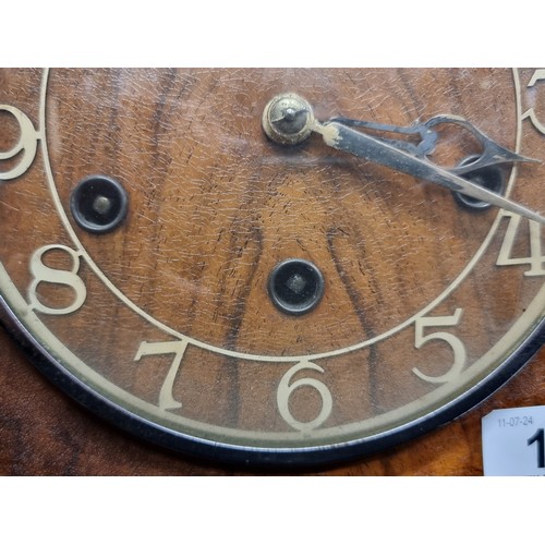 198 - Two  antique mahogany art deco mantle clocks. Including an eight day and chiming example.