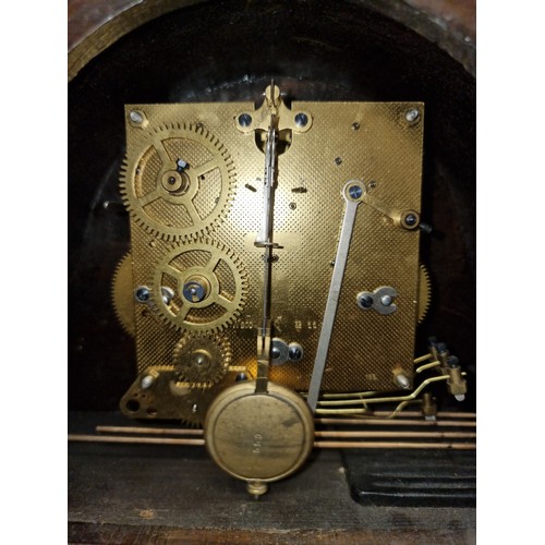 198 - Two  antique mahogany art deco mantle clocks. Including an eight day and chiming example.