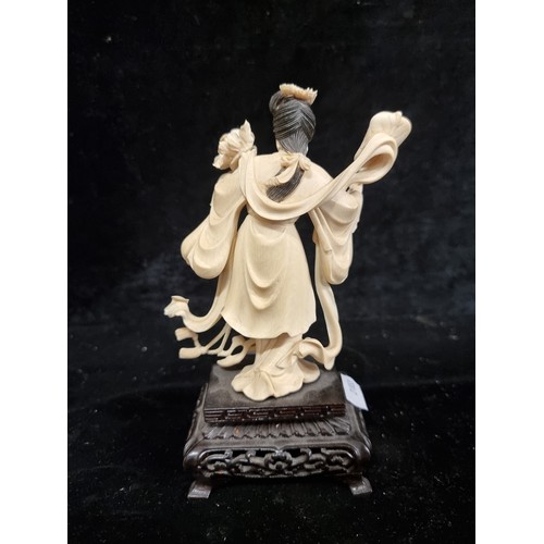 262 - Star lot : A stunning intricate carved antique bone Japanese figure on wooden ebonised base. So much... 