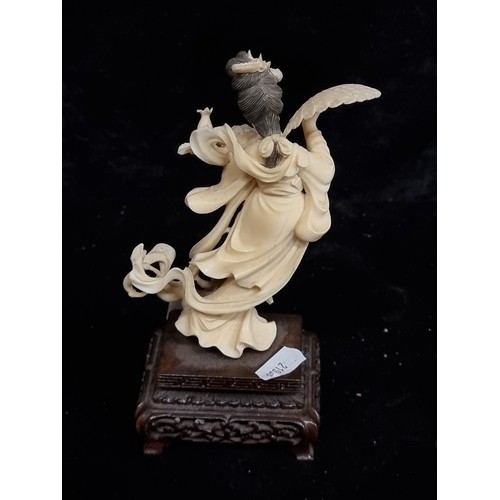 273 - Star lot : An intricate antique hand carved Japanese bone figurine mounted on wooden base.