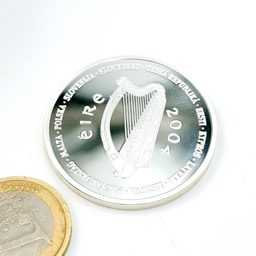 1 - A sterling silver proof ten euro coin dated 2004. Weight - 28.28 grams. To mark in the accession of ... 