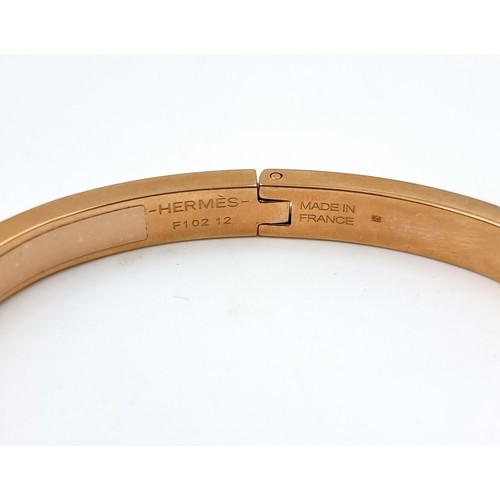 19 - An original Designer Hermes Bracelet . Reference - F102T2. Made in France. Marks to inner band. Weig... 