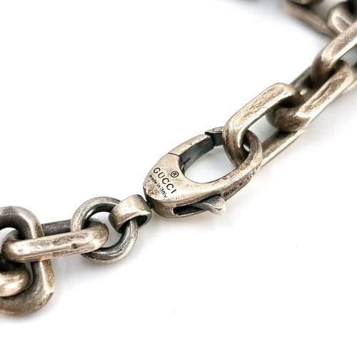 24 - Star Lot : An original designer Gucci sterling silver chain link bracelet set with lobster clasps. W... 