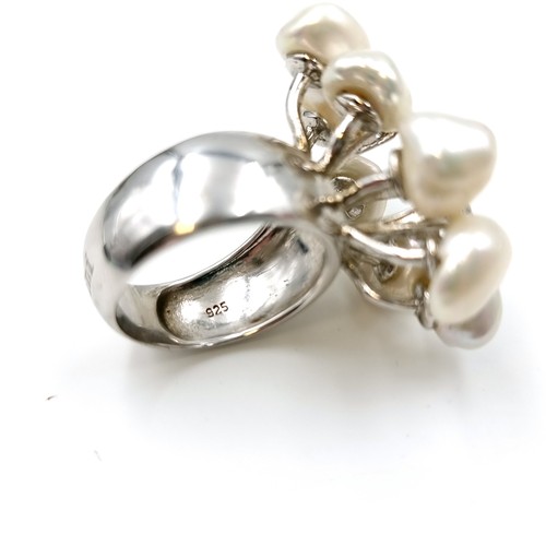 53 - A very unusual eight cultured pearl ring with three gem set accents. Ring size - N. Weight - 11.6 gr... 