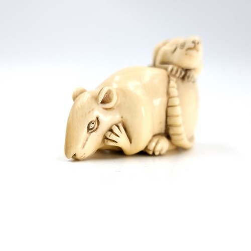 501 - A most attractive original Japanese carved antique bone Netsuke (two holes) in the form of a mother ... 