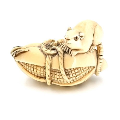 513 - A super carved original Japanese antique Netsuke (two holes) depicting a rat mounted on a sweetcorn ... 