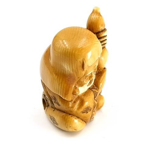 516 - An antique original Japanese  bone carved Fukurokuju Netsuke figure (two holes). Marks to base. Dime... 