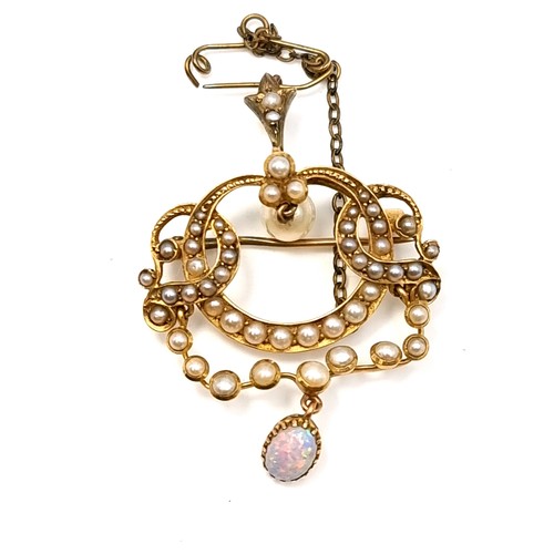 533 - A most attractive antique pearl set brooch with a super fire opal drop pendant. Together with pin sa... 