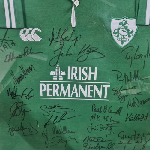 1005 - Star Lot: A very large framed early 2000's signed Irish rugby jersey. Brian O'Driscoll and Paul O'Co... 