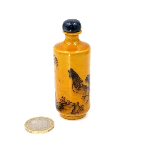 511 - A cylindrical antique Chinese perfume bottle with floral and bird scenes to body. Base signed Chengh... 