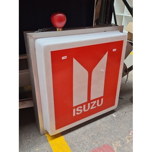 401 - Star Lot : Vintage original Isuzu illuminated dealership sign. It has a metal frame and hanging chai... 