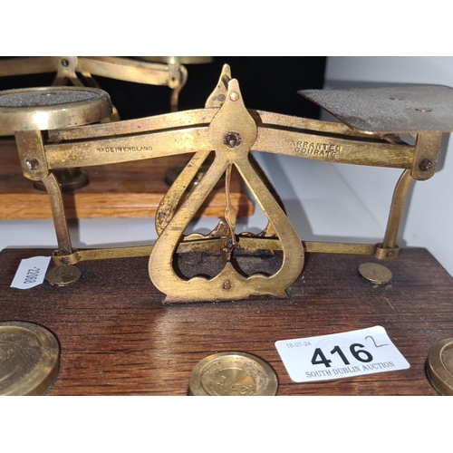 416 - Set of two vintage brass balance scales on wooden bases marked 