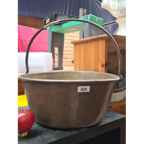 420 - Antique large brass preserve pot with a sturdy metal handle. Period: Heavy 19th century example.