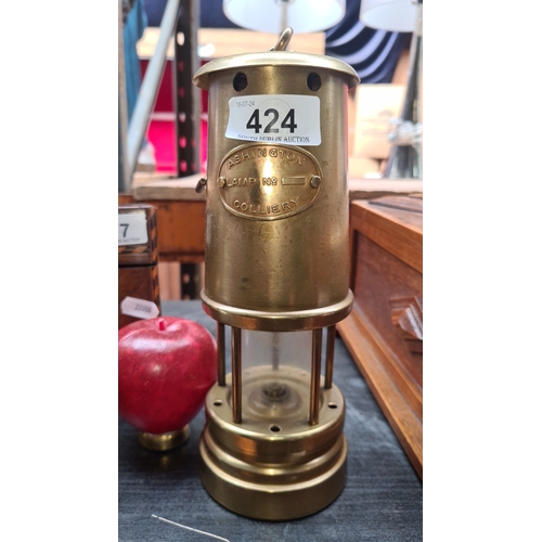 424 - Antique brass Ashington Colliery paraffin miner's lamp, marked Ashington Colliery 