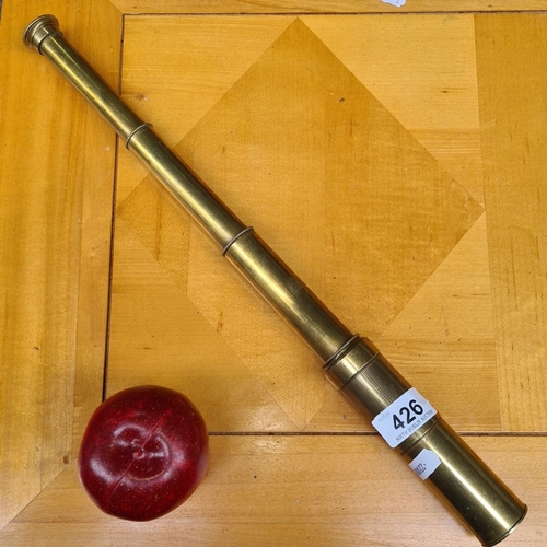 426 - Antique brass collapsible monocular telescope, likely 19th century. Features a three-draw design.