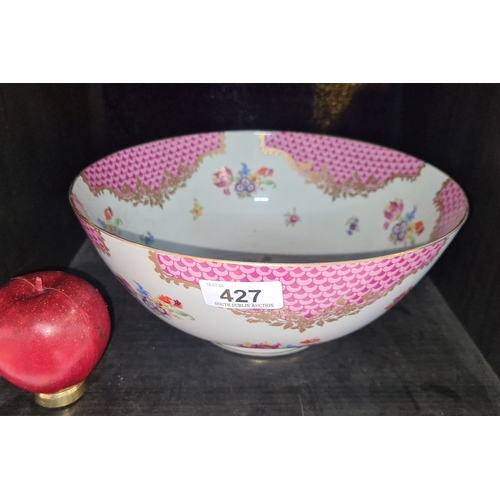 427 - A large Chinese 19th century porcelain bowl with intricate floral designs and pink patterned border,... 