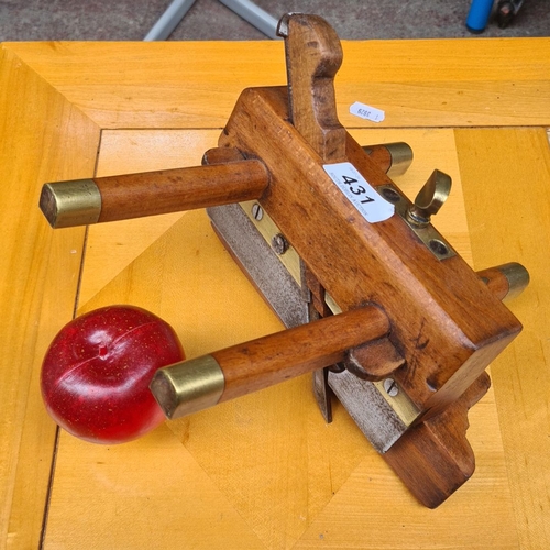 431 - An antique wooden plow plane with brass fittings, signed 