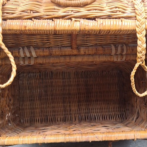 445 - Large woven wicker trunk and a wicker laundry hamper. The trunk features durable handles and braided... 