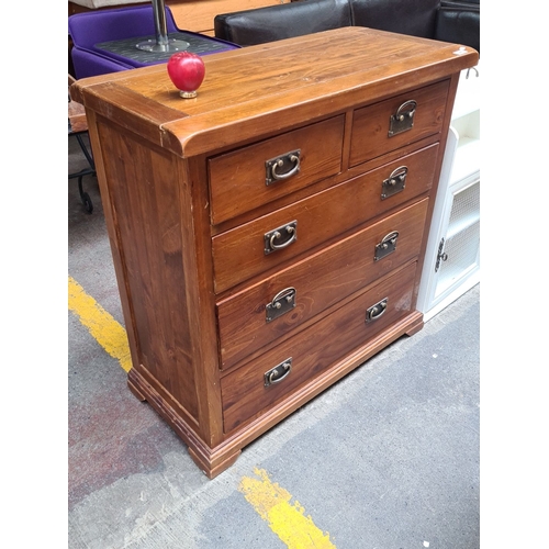 446 - Solid wood chest of drawers with four large and two smaller drawers, featuring metal handles.