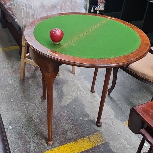 453 - A lovey Edwardian mahogany demi-lune flip over card table. It's transformable into a circular table ... 