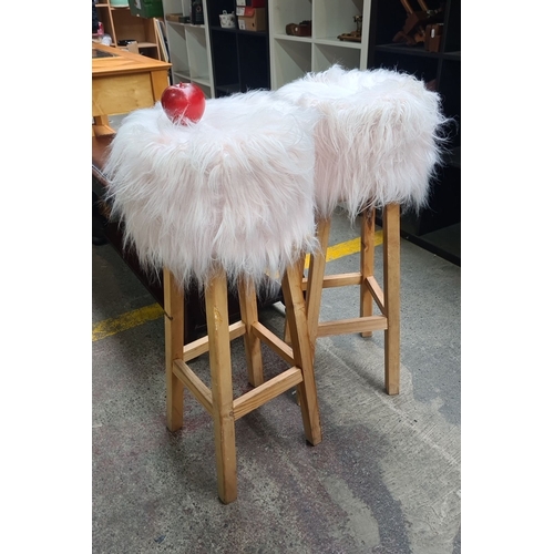 454 - Pair of contemporary fluffy white bar stools with wooden legs. very funky.