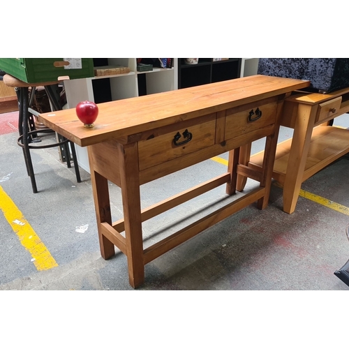 457 - Solid wood console table with two drawers featuring dark metal handles. The table highlights the nat... 