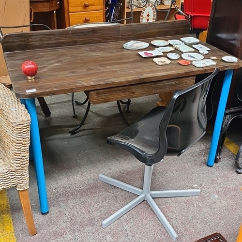 464 - Wooden writing desk with blue metal legs. Includes a spacious drawer for storage. Comes with a sleek... 