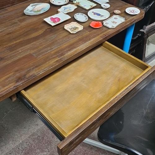 464 - Wooden writing desk with blue metal legs. Includes a spacious drawer for storage. Comes with a sleek... 