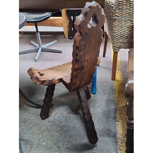 478 - Rustic wooden chair with intricate carved details. Features unique, handcrafted design with a natura... 