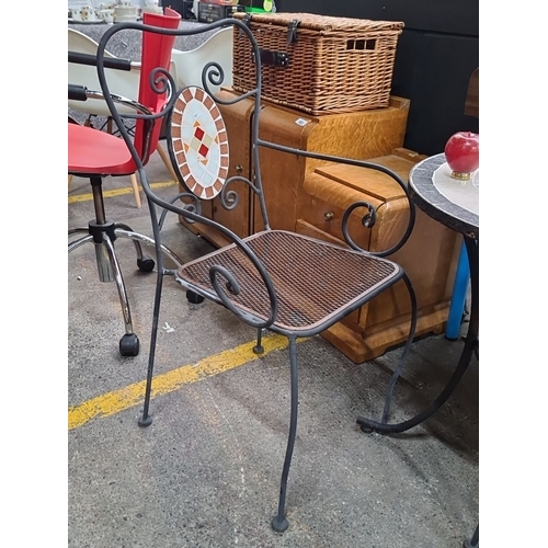 479 - Bistro set with wrought iron construction and mosaic tile inlay. Comes with a round table and two ma... 