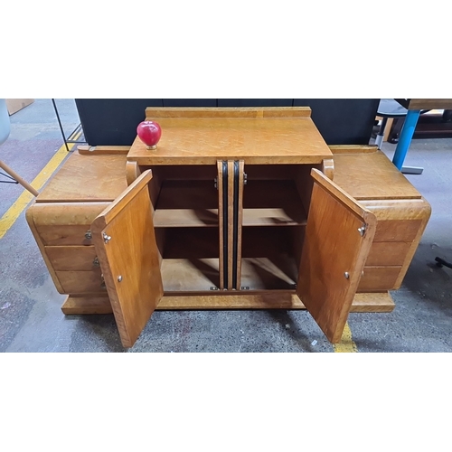 481 - Star Lot : A very funky Art Deco sideboard in light maple veneer, with two central doors flanked by ... 