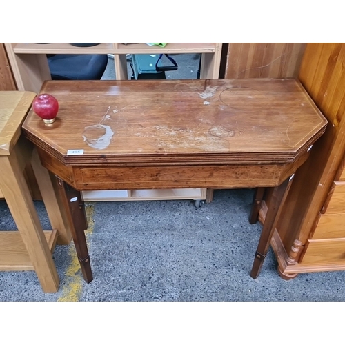 495 - Victorian fold-out oak games table with tapered legs. Unique octagonal design, showcasing craftsmans... 