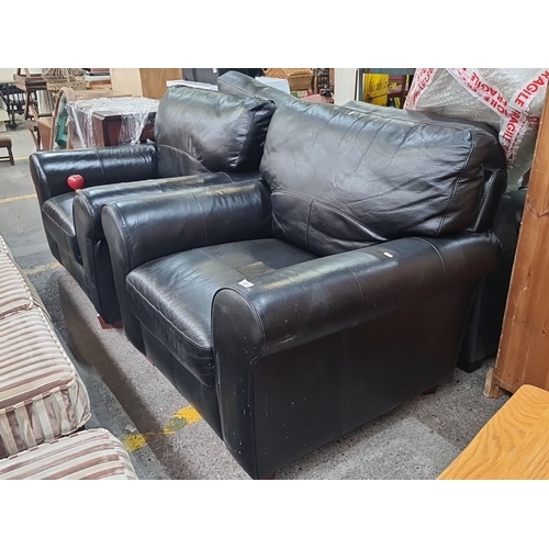 497 - A pair of very comfortable black leather chairs  with cushioned back and armrests. In very good cond... 