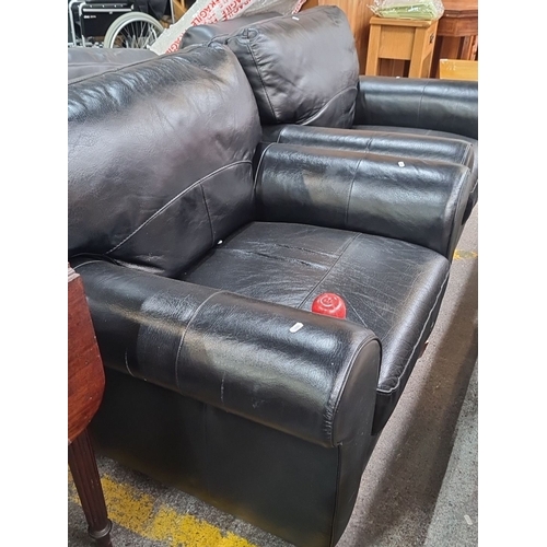 497 - A pair of very comfortable black leather chairs  with cushioned back and armrests. In very good cond... 