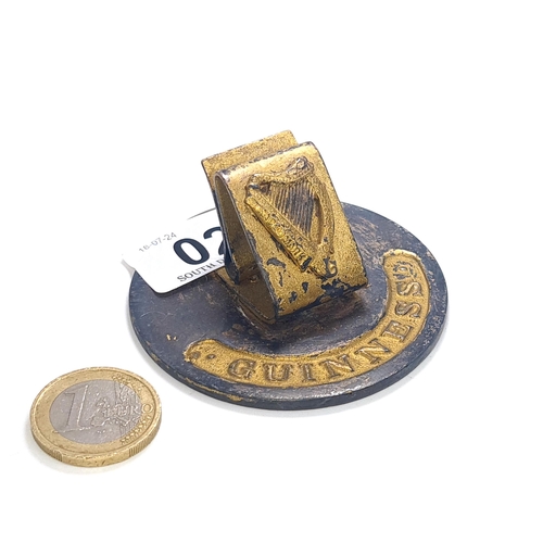 27 - A vintage Guinness table place marker set with Irish harp. Dimensions Base 6cm diameter X 3cm H. Tot... 