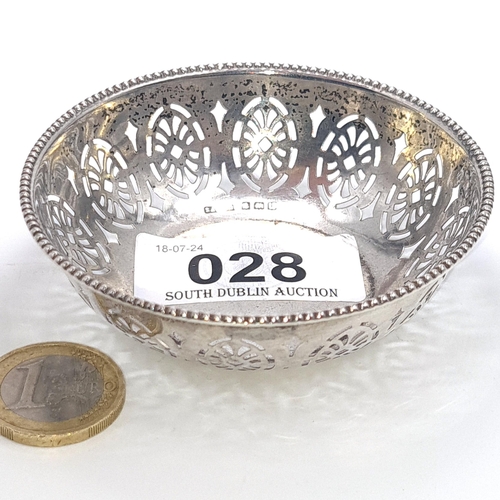 28 - A pierced sterling silver pin dish with hallmarks for Birmingham. Features a pierced design to body.... 