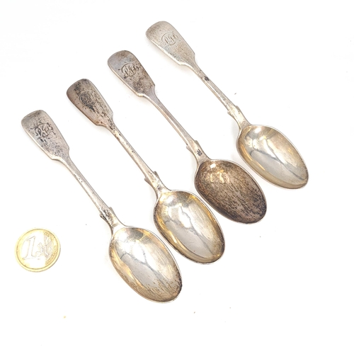 43 - Star Lot : A collection of four sterling silver Victorian teaspoons with initialed fiddle patterned ... 