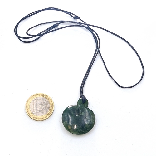 47 - A cold to the touch dark green jade pendant necklace. Weight of jade 8.46 grams. Stone cold to touch... 