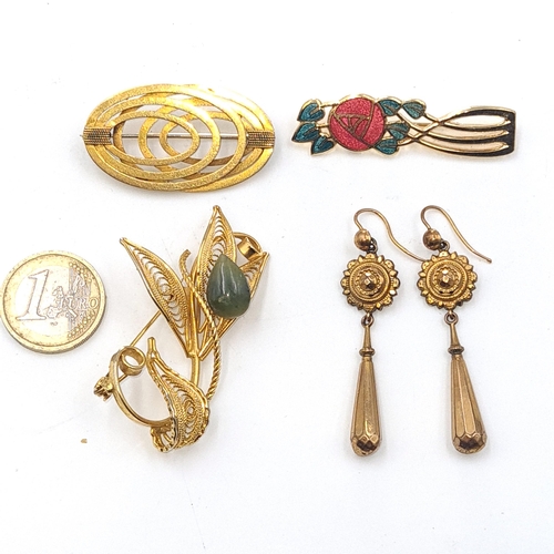 49 - A collection of vintage jewellery items consisting of three brooches with pins intact, together with... 