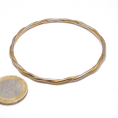 54 - Star Lot : A nine carat gold 375 bracelet bangle. Internal dimensions 6.5cm. Weight 13.42 grams. The... 