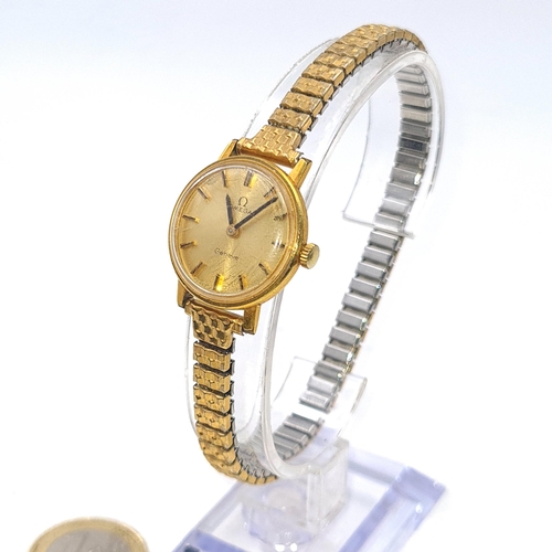 55 - Star Lot : An Omega ladies wrist watch with baton dial and expandable bracelet. In working condition... 