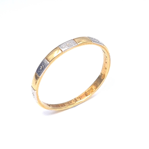 58 - A very dainty bi colour 18 carat gold ring. Hallmarked Birmingham. Size L. Weight 1.24 grams.